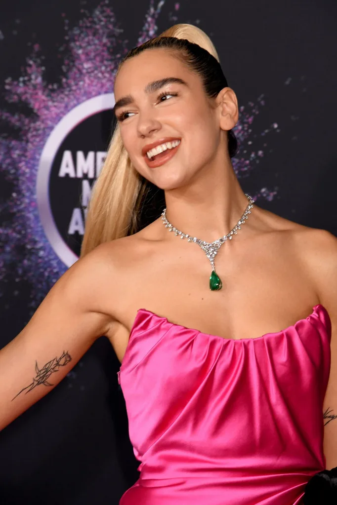 dua lipa cybersigilism tattoo on her arm