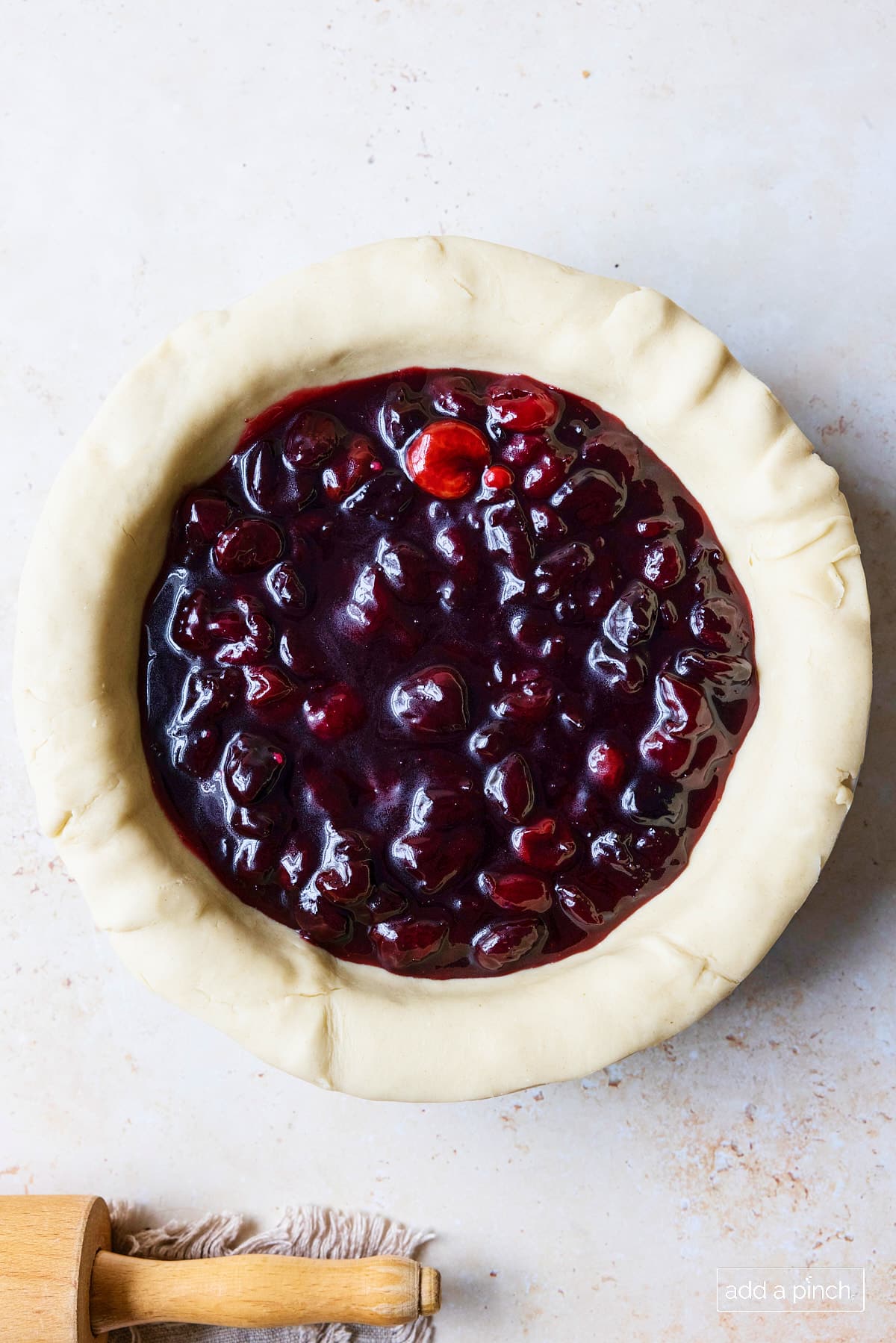 Cherry pie filling in an unbaked pie crust.