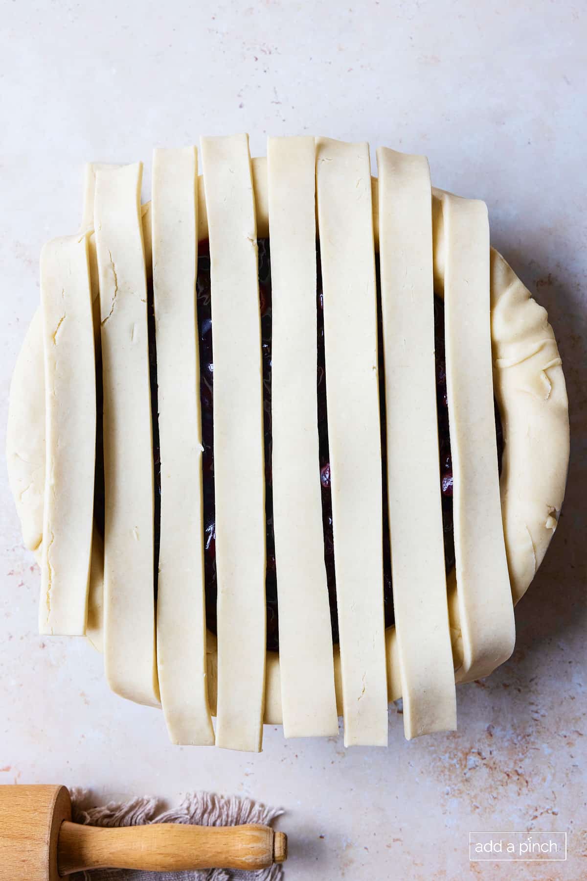 Step 1 of making lattice pie crust topping