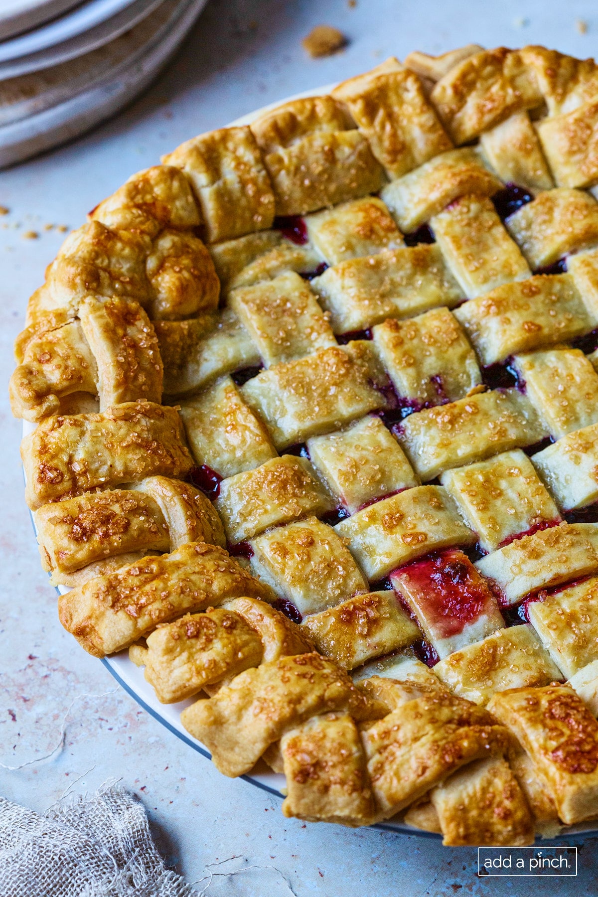 Baked cherry pie on a white surface