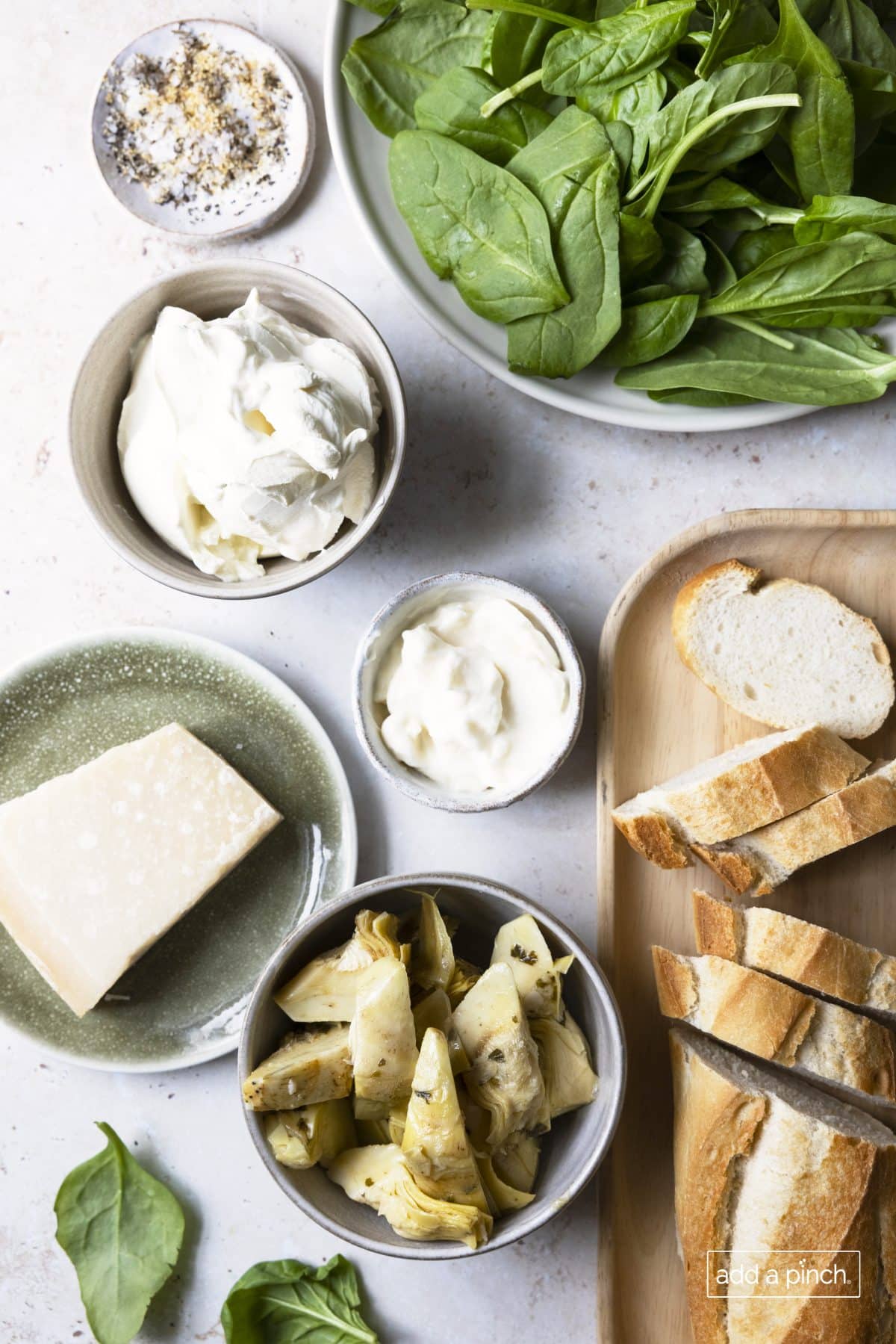 Ingredients to make spinach artichoke dip recipe.