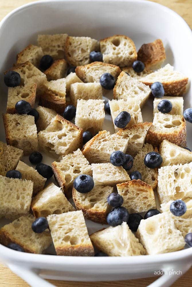 Baked Blueberry French Toast Recipe - This Baked Blueberry French Toast makes a delicious breakfast or brunch recipe! Made with bread, blueberries, maple syrup and topped with a streusel topping, this is always a favorite! // addapinch.com