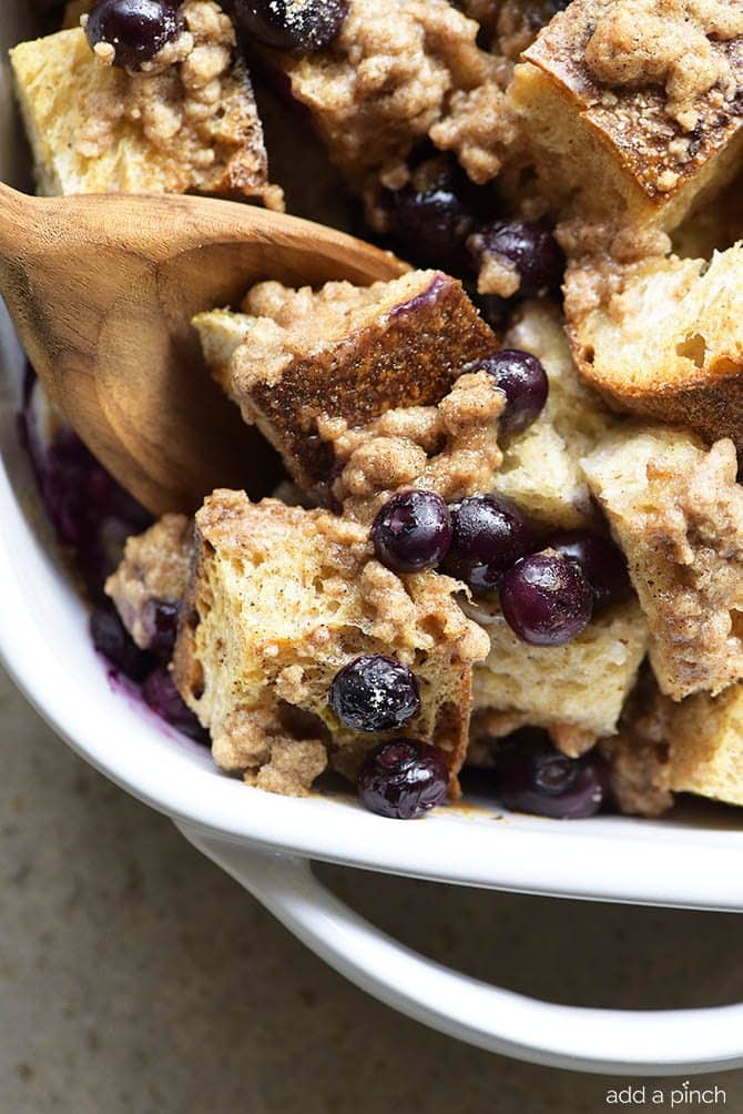 Baked Blueberry French Toast Recipe - This Baked Blueberry French Toast makes a delicious breakfast or brunch recipe! Made with bread, blueberries, maple syrup and topped with a streusel topping, this is always a favorite! // addapinch.com