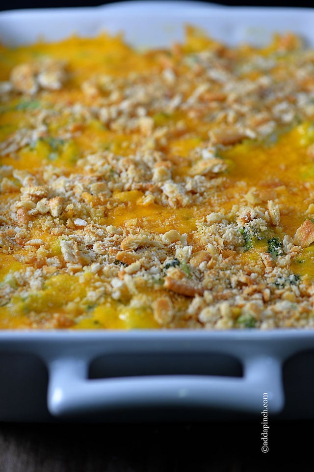 Large casserole dish of Broccoli Cheese Casserole from addapinch.com