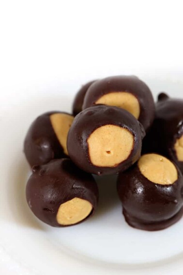 Buckeyes makes a favorite peanut butter and chocolate candy. Named for the nut of the same name, buckeyes are loved through the holidays and all year. // addapinch.com