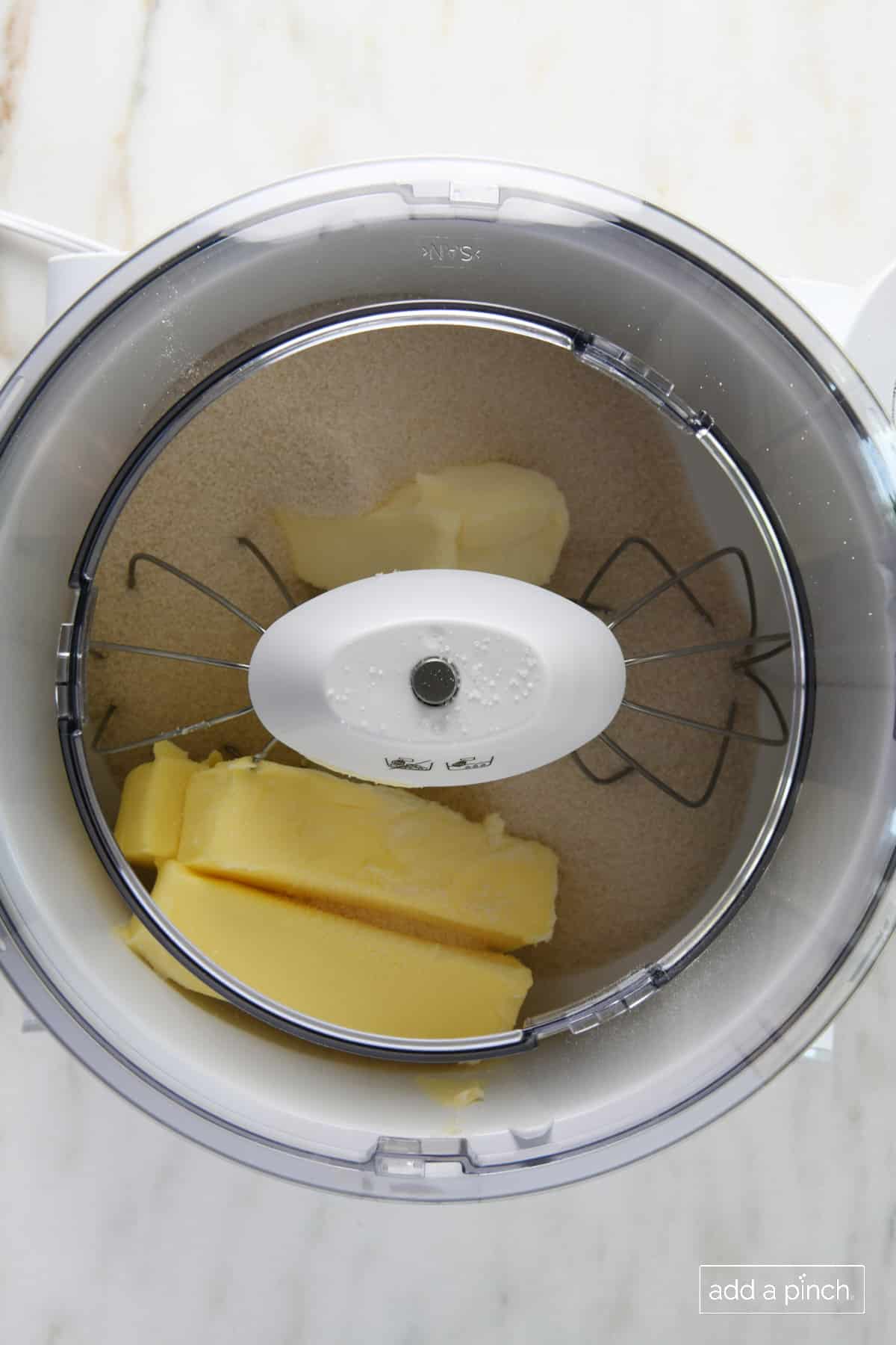 Cream together the butter, sugar, and cream cheese in a mixer.