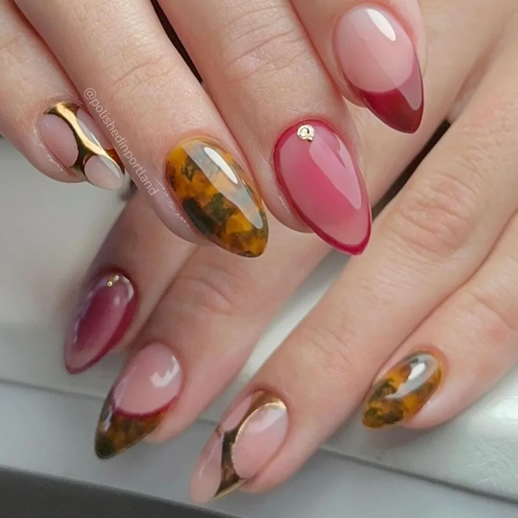 Varied oval nails with tigers eye and sheer burgundy