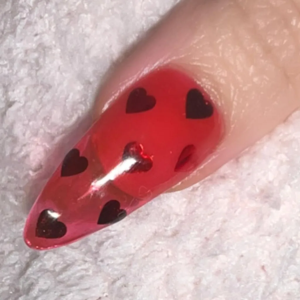 Sheer cherry red acrylics with hearts 