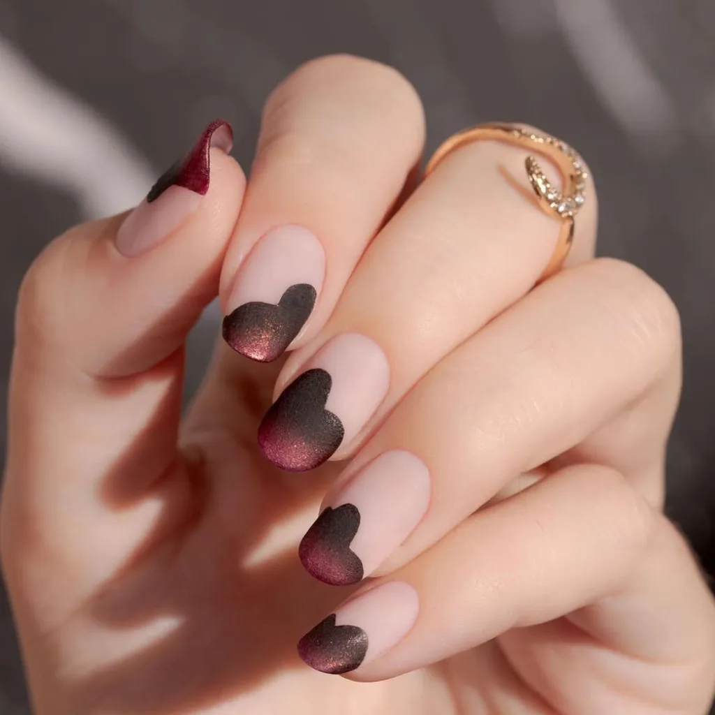 Matte burgundy and black velvet love heart detailed manicure