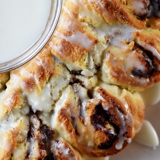 Cinnamon Roll Biscuit Wreath Recipe - Quick and easy this treat has everything you love about a cinnamon roll with the ease of a biscuit in the shape of a festive wreath! // addapinch.com