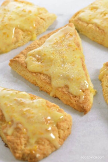 Citrus Scones Recipe with Orange Glaze on a white plate.