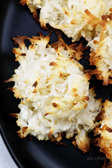 Easy Coconut Macaroons Recipe - These easy coconut macaroons are made with just five ingredients. Golden brown, they are light, chewy and filled with flavorful coconut! // addapinch.com