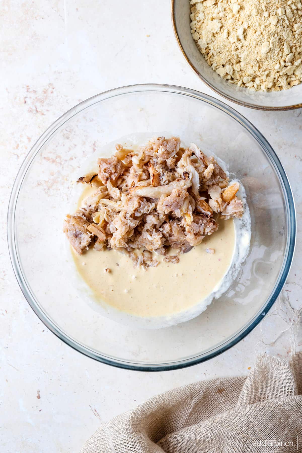 Bowl of mixed mayo ingredients and lump crab.