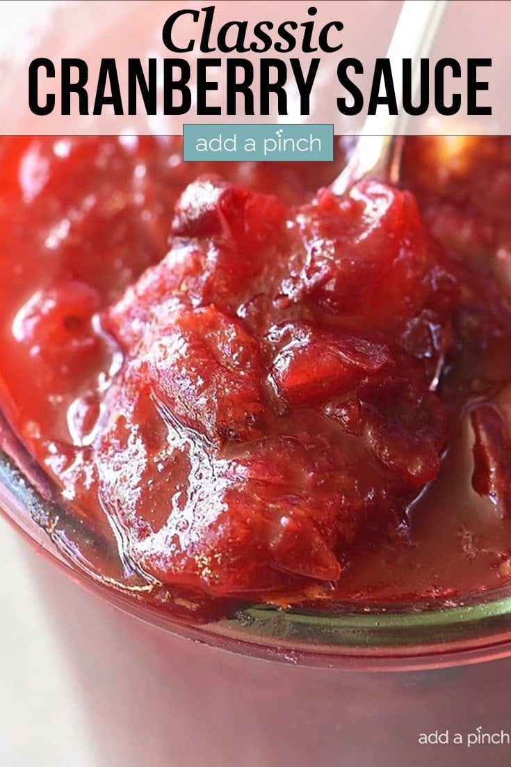 Closeup of Cranberry Sauce in glass bowl - with text - addapinch.com