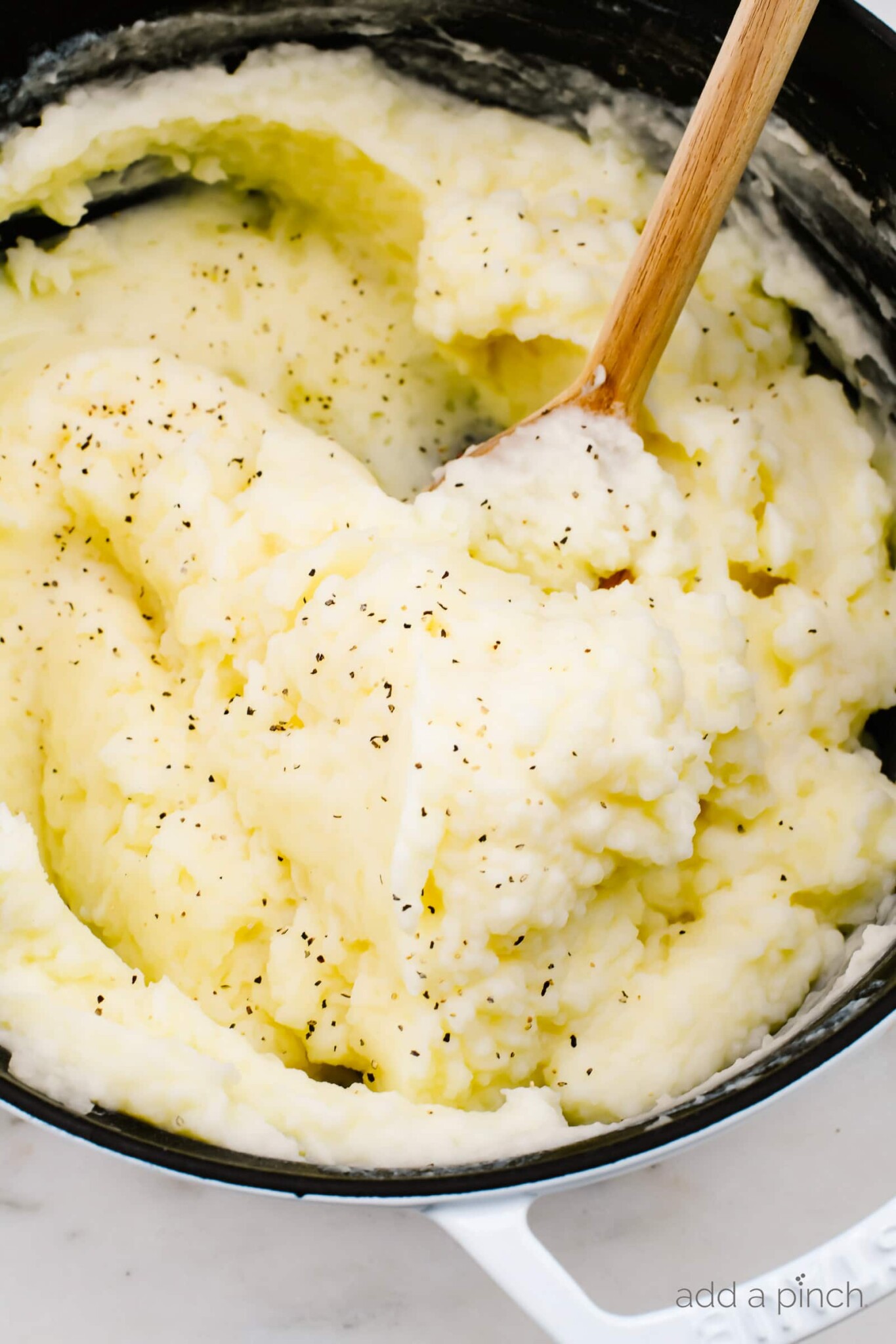 Buttery fluffy mashed potatoes topped with black pepper