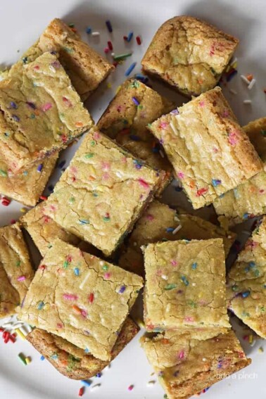 Funfetti Blondies Recipe - Funfetti Blondies make just the perfect bar cookie for celebrations! Made from scratch, these funfetti blondies are chewy, delicious and so fun! // addapinch.com