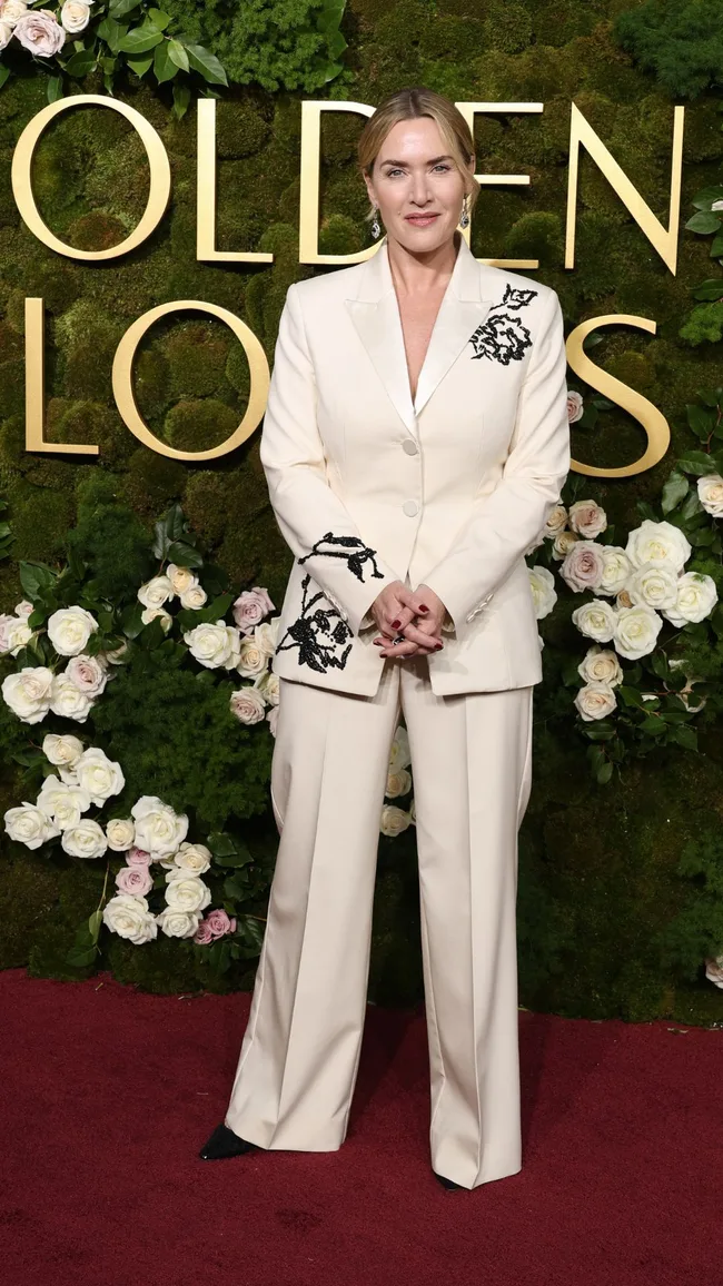 golden globes red carpet 2025 kate winslet wears white suit with black floral details