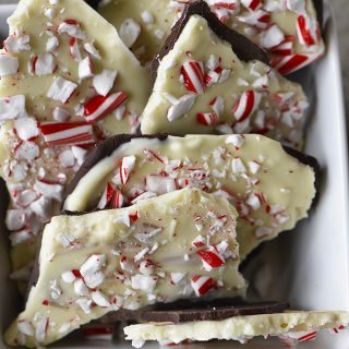 Homemade Peppermint Bark Recipe - Peppermint Bark makes a favorite holiday treat! This homemade peppermint bark recipe is made with layers of peppermint filled milk chocolate and white chocolate and then topped with peppermint candy. // addapinch.com