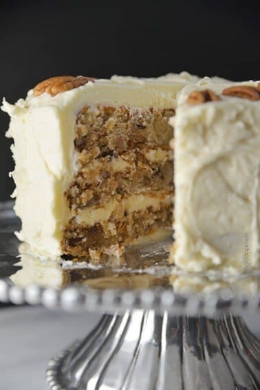 Hummingbird Cake Recipe - Hummingbird Cake is a classic, Southern cake recipe. Made with bananas, pineapple, and pecans and topped with a cream cheese frosting! from addapinch.com