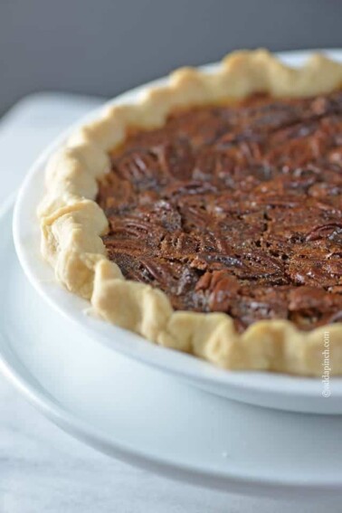 The BEST Pecan Pie Recipe - This Pecan Pie Recipe is a classic in my husband's family. For every family gathering, you better believe there will be pecan pie sitting front and center on the dessert table. Every. single. time. // addapinch.com