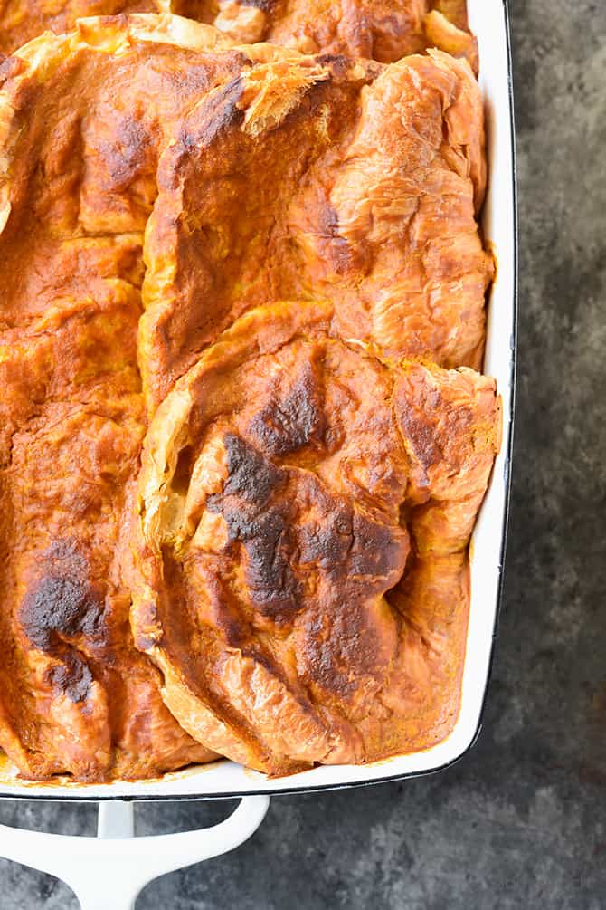 Closeup of cooked pumpkin custard in this bread pudding.