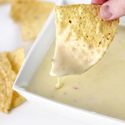 Queso dip makes a delicious appetizer. Made with a special combination of cheeses and ready in 5 minutes, this queso will be a favorite!  // addapinch.com