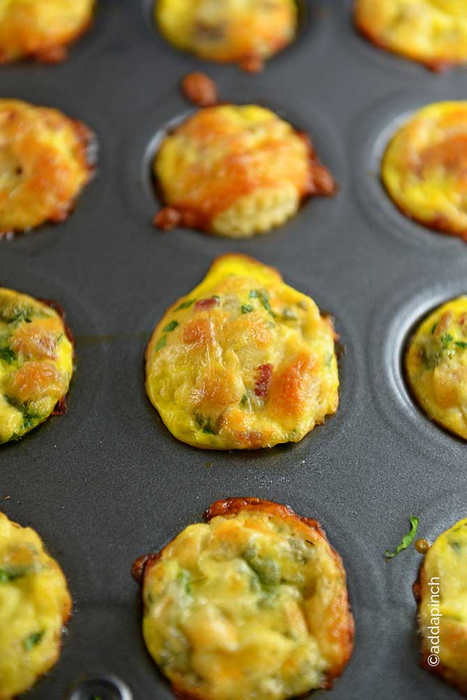 Closeup of golden Mini Quiche in a muffin tin. 