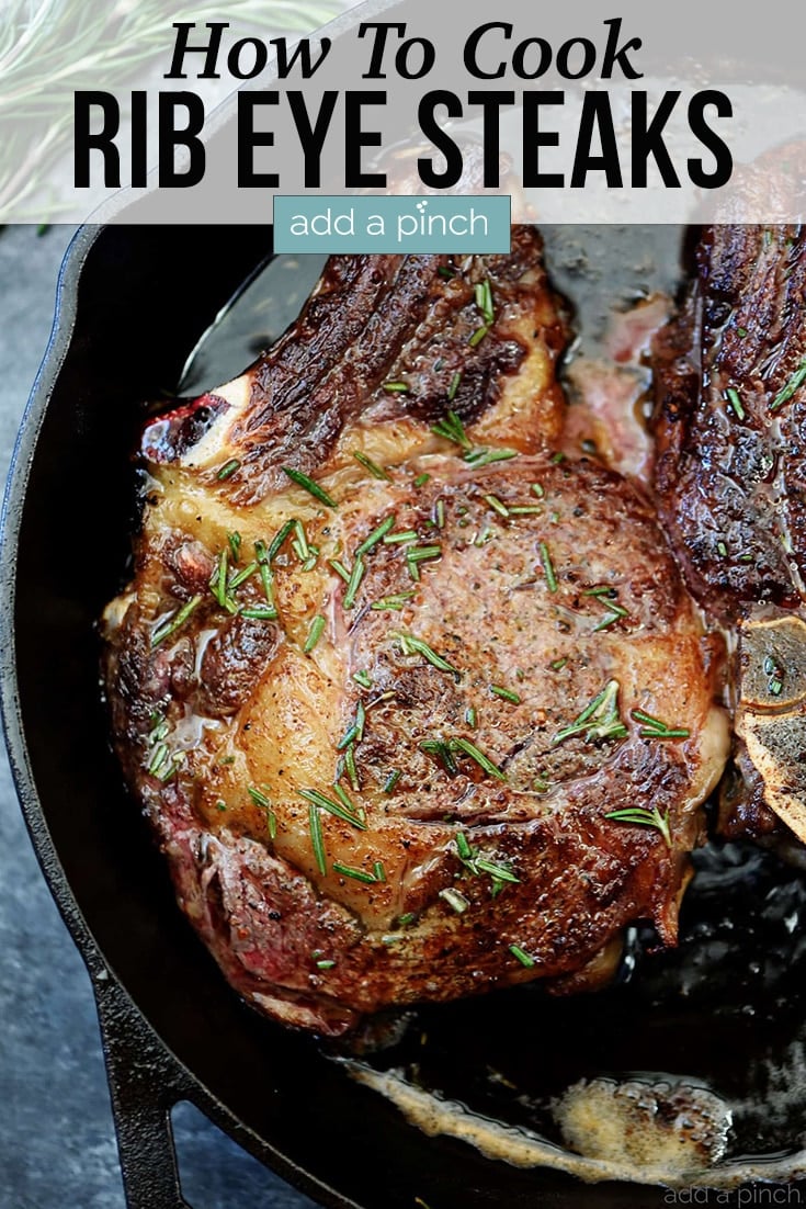 Skillet Rib Eye Steaks basted in butter topped with rosemary.