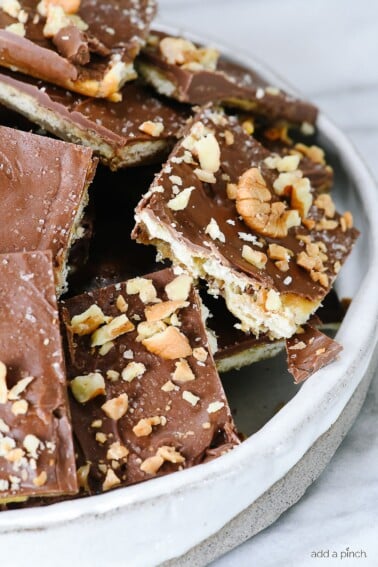 Saltine Cracker Toffee Candy Recipe - Cracker toffee or Christmas crack is a favorite, easy recipe made with only five ingredients! // addapinch.com