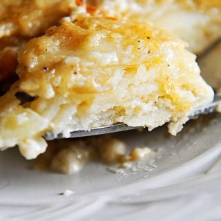 Scalloped Potatoes Recipe - This easy scalloped potatoes recipe is so creamy, cheesy, and out of this world delicious! // addapinch.com