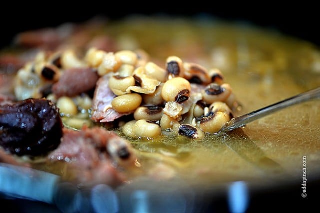 Black Eyed Peas in a pot with ham bone. 