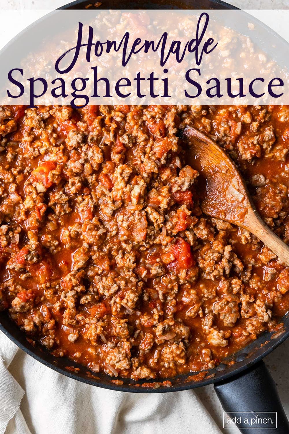 Skillet full of meaty spaghetti sauce - with text - addapinch.com