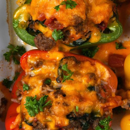 Photo of stuffed peppers in a baking dish.