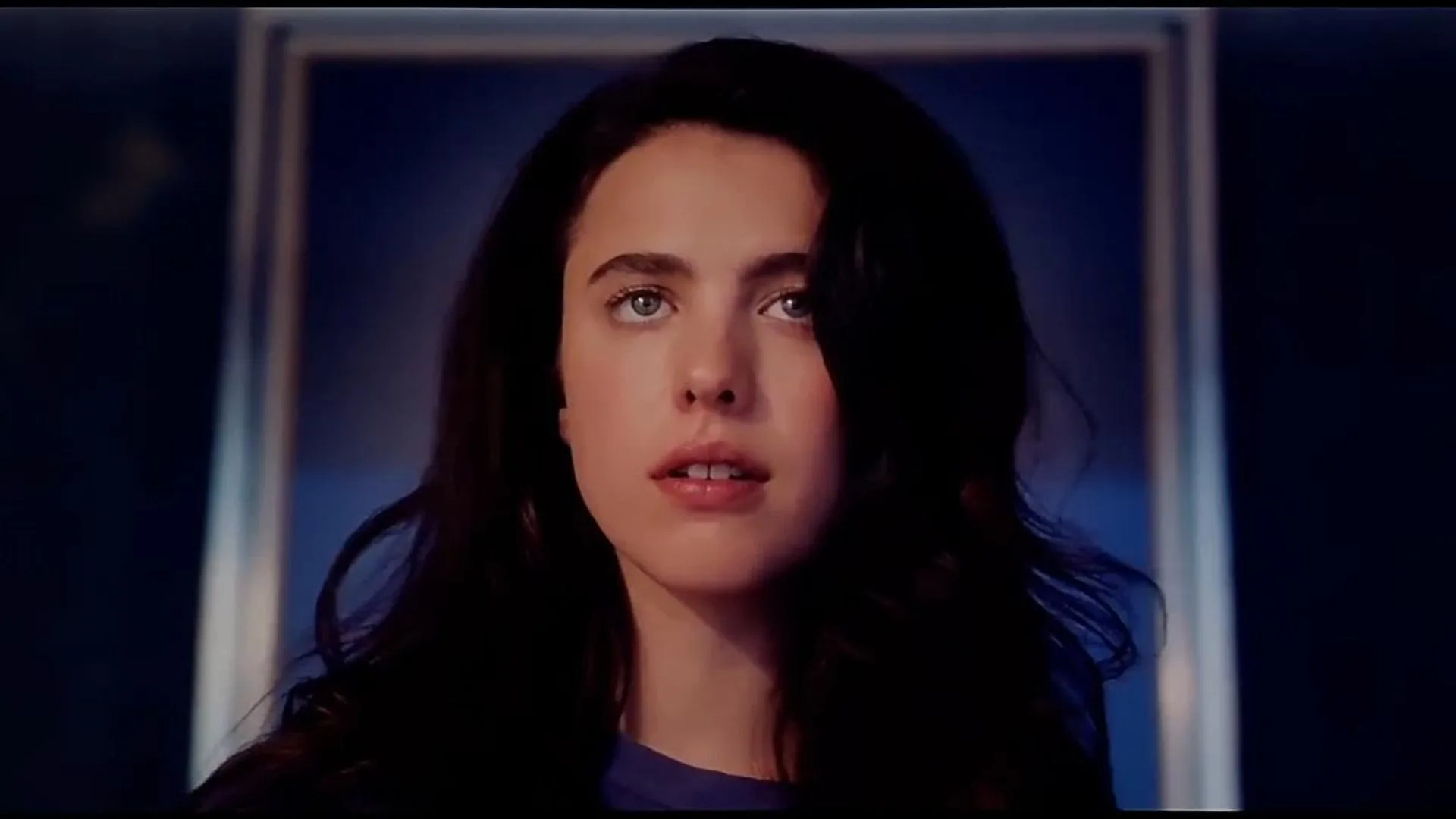 margaret Qualley stares ahead in the substance