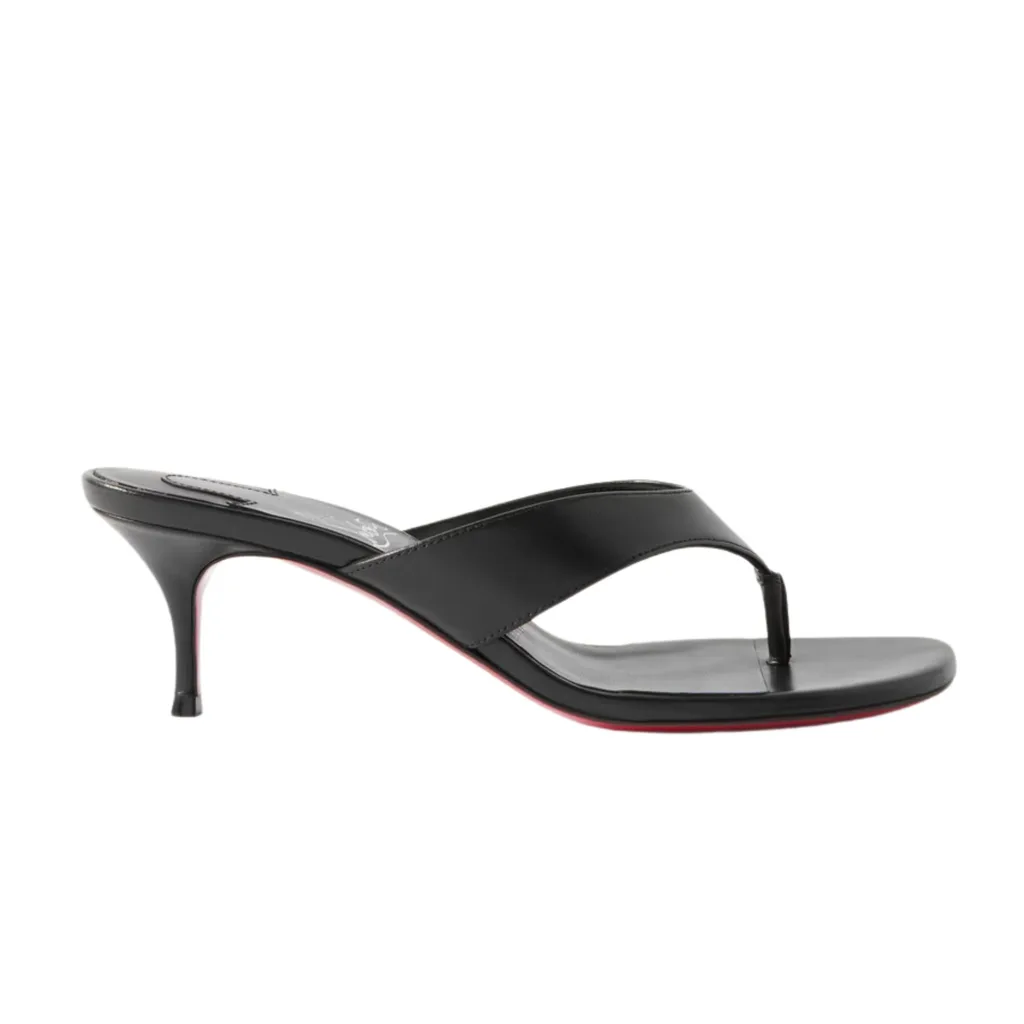 The Christian Louboutin Raratonga 55 Leather Sandal is a beautifully sloped, elegant thong heel with a 2-inch stiletto and the traditional "Loubi" red sole. Pictured here in black it is also available in white. 