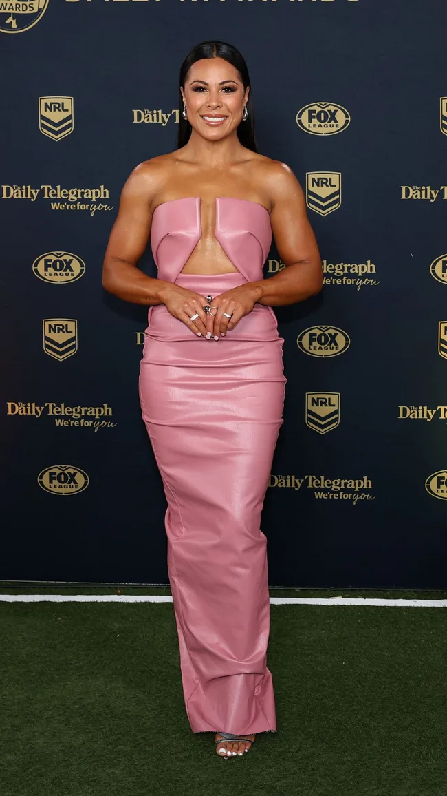 Tiana Penitani of the Sharks wears a pink cutout gown on the dally ms red carpet