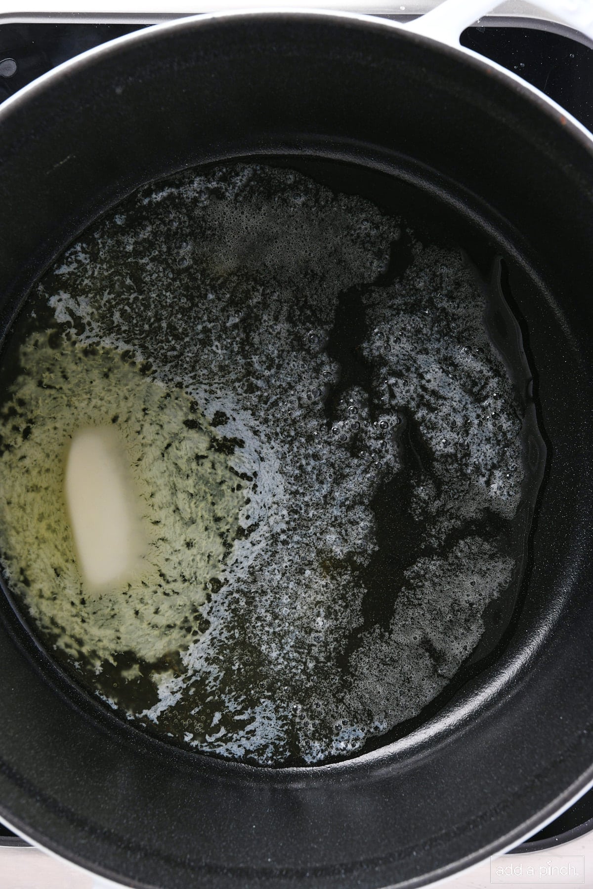 Melted butter in a dutch oven.